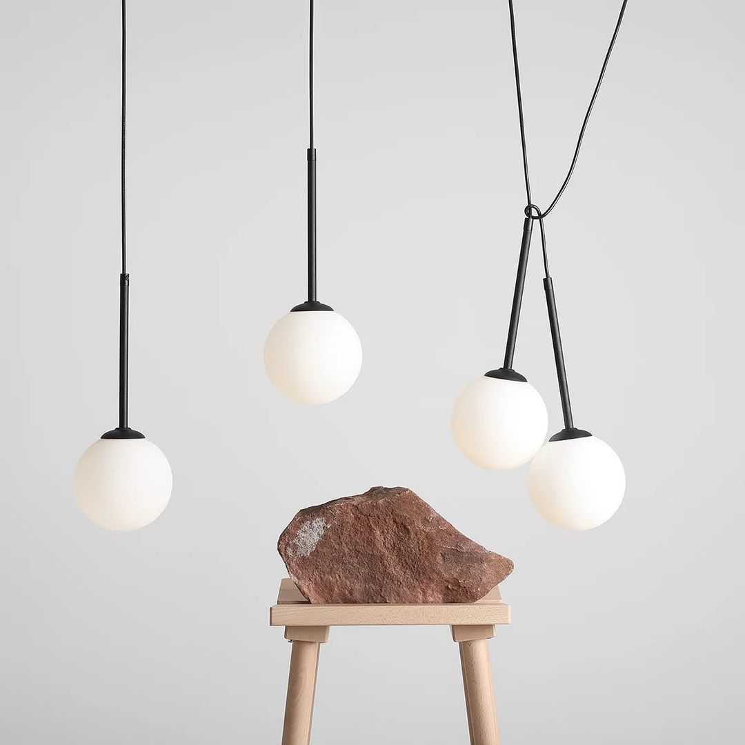 2023-05-20_3107118618743391718_e6ad64d0-0f9b-4dcb-9f5c-47657d6b3d87 Modern Linear 4 Globe Staggered Black Pendant - Image 1